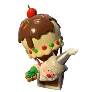 Hallmark Keepsake Santas Sweet Ride Ornament 2011 Ice Cream Santa Holding Gift